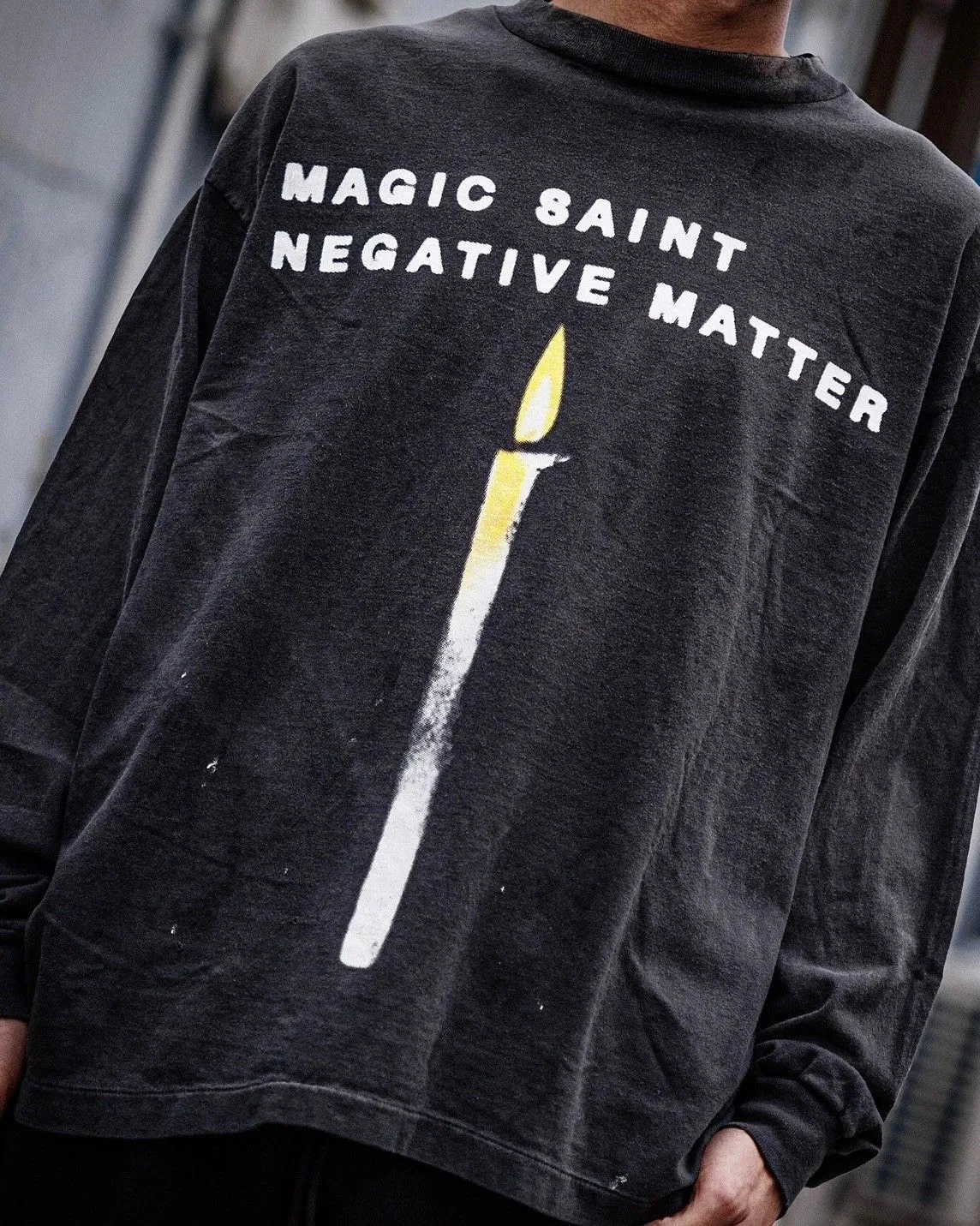 SAINT Mxxxxxx CANDLE LS TEE/BLK Slogan candle distressed long-sleeved TEE with angel short sleeves on the back. Washed black S-XL. Same as the original. Cylindrical side seam OE yarn fabric. Garment dyeing. Faded by heavy washing. Faded by plaster on bust. Correct alignment. Original consistent main mark/wash mark/cherub anti-counterfeiting mark. Original level printing restoration.